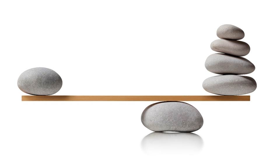 Stones balancing on a wood